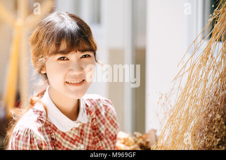 Asian Girl young teen hipster closeup head happy smile vintage colortone Stock Photo