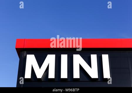 Villefranche sur Saone, France - September 27, 2015: Mini logo on a facade of a dealer. Mini is a British automotive marque owned by BMW Stock Photo