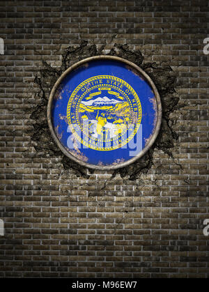 3d rendering of a Nebraska State flag over a rusty metallic plate embedded on an old brick wall Stock Photo