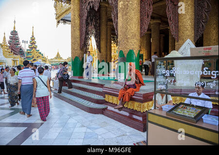 The Shwedagon Pagoda officially named Shwedagon Zedi Daw and also known as the Great Dagon Pagoda , is a gilded stupa located in Yangon Myanmar Stock Photo