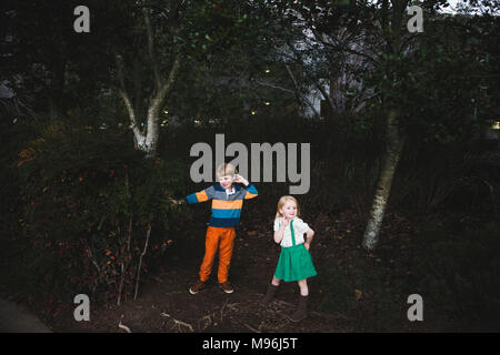 A brother and sister playing in the woods Stock Photo - Alamy