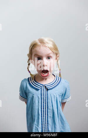 Girl pulling faces Stock Photo