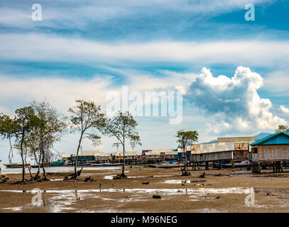 Village of Sea Gypsies during low tide. Asian traditional wooden houses on stilts. Floating houses village in Maumere, Flores Island, Indonesia Stock Photo