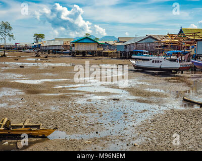 Village of Sea Gypsies during low tide. Asian traditional wooden houses on stilts. Floating houses village in Maumere, Flores Island, Indonesia Stock Photo