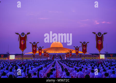 Pathumthani, Thailand - March 4, 2015: Many Buddhists doing meditation in front of Dhammakaya Cetiya in Dhammakaya temple of Pathumthani, Thailand Stock Photo