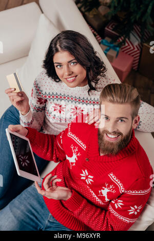 couple making e-shopping with tablet on christmas Stock Photo
