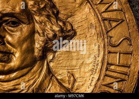 A close-up of one side of gold medallion showing George Washington on WW1 memorial, Olympia, Washington State, USA Stock Photo