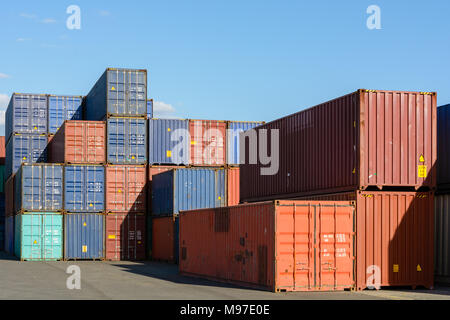 Dozens of containers stacked in a shipping yard on the river Marne for the supply of supermarkets in Paris. Stock Photo