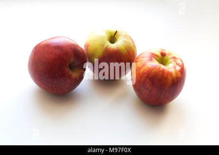 Three ripe red apples isolated on white background Stock Photo