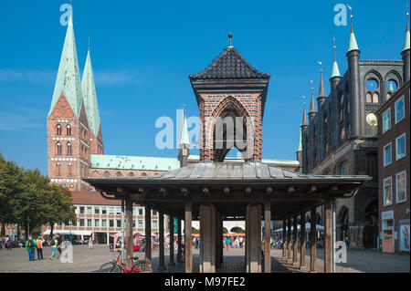 The Kaat also called pillory at the market with Marien church and wing wall of the town hall, Lubeck, Baltic Sea, Schleswig-Holstein, Germany, Europe Stock Photo
