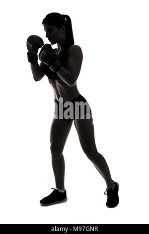 one caucasian woman boxing exercising in silhouette studio isolated on white background Stock Photo