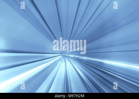 Speed blurred motion of train or subway train moving inside tunnel. Stock Photo