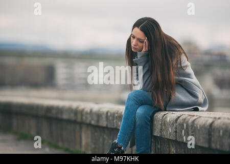 a sad girl sitting alone wallpaper