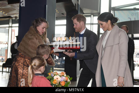 Prince Harry and Meghan Markle are presented with a model of the ship by Lleyton Jackson 6 and Rosie Jackson 4, during a visit to Titanic Belfast maritime museum in Belfast. Stock Photo