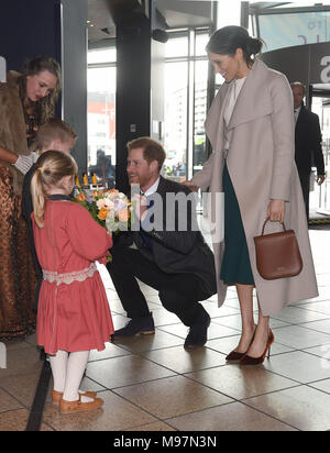 Prince Harry and Meghan Markle are presented with a model of the ship by Lleyton Jackson 6 and Rosie Jackson 4, during a visit to Titanic Belfast maritime museum in Belfast. Stock Photo