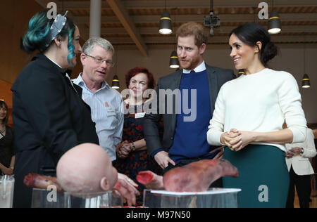 Nuala Campbell and Eoin Lambkin from Titanic FX show Prince Harry and Meghan Markle some prosthetic limbs used in the movie industry during a visit to Catalyst Inc science park in Belfast where they met some of Northern Ireland's brightest young entrepreneurs. Stock Photo