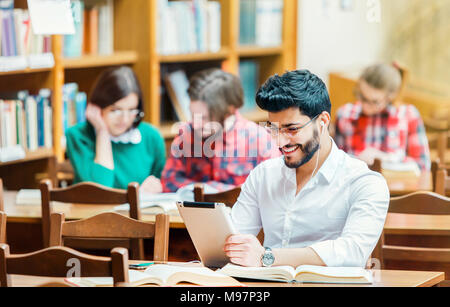 Student in the Library with Tablet PC Stock Photo