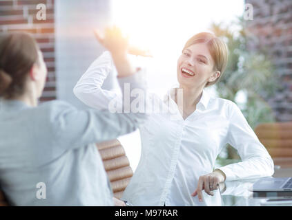 members of the business team happy to the results and giving a high five Stock Photo