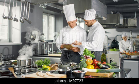 Stainless hotel pans on food warmers with various meals. Roasted meat  pieces with vegetable. Self-service buffet table. Celebration, party,  wedding Stock Photo - Alamy