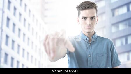 Man touching air in city Stock Photo