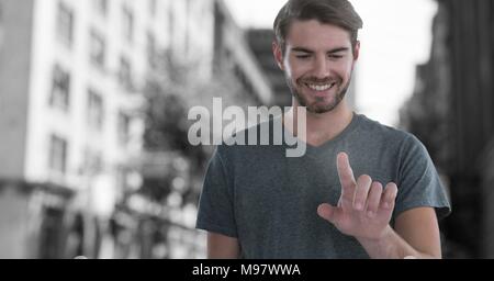Man touching air in city Stock Photo
