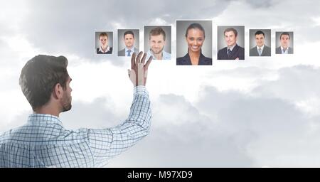 Man touching portrait profiles of different people Stock Photo