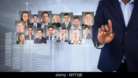 Hand touching portrait profiles of different people Stock Photo