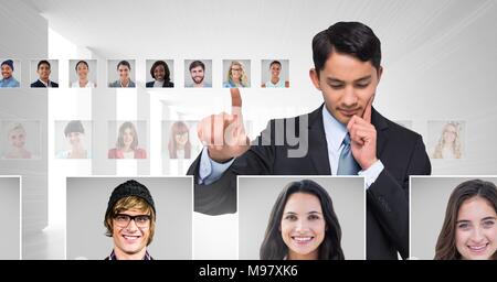 Man touching portrait profiles of different people Stock Photo