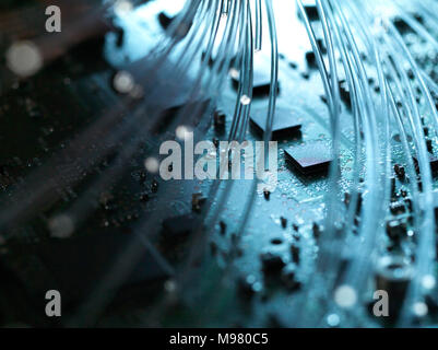 Fibre optics, hardware, circuit board in the background Stock Photo