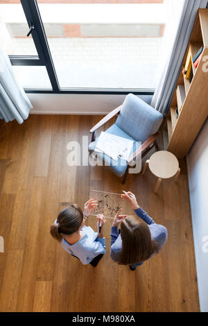 Group of female architects having a meeting, seen from directly above Stock Photo
