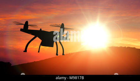 Drone silhouette flying towards sun. Black quadcopter with rotating propellers on sunset in rendered concept of innovations and technology. Stock Photo
