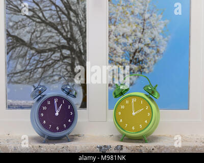 3D render of two alarm clocks indicating wintertime and springtime placed on windowsill with two pane-window showing outdoor growing tree in winter an Stock Photo