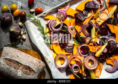 Pumpkin panzanella, bread salad of pumpkins, onions, tomatoes, grapes and figs Stock Photo