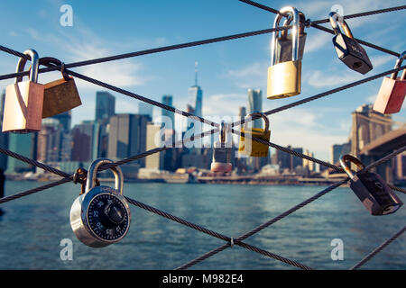USA, New York City, skyline and love padlocks as seen from Brooklyn Pier Stock Photo