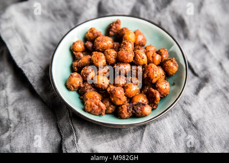 Roasted chickpeas in bowl Stock Photo