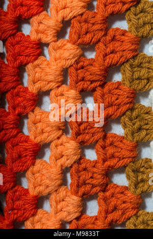 a handmade crochet fabric of different colors Stock Photo