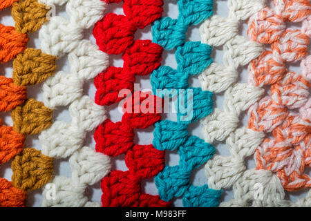 a handmade crochet fabric of different colors Stock Photo