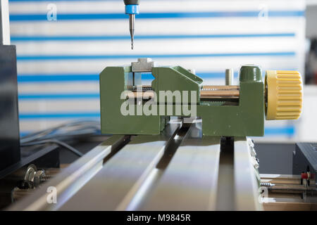 Processing of the plastic workpiece on CNC milling machine Stock Photo
