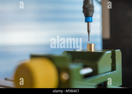 Processing of the plastic workpiece on CNC milling machine Stock Photo
