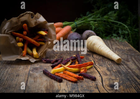 Organic beetroot, carrot and parsnip fries Stock Photo