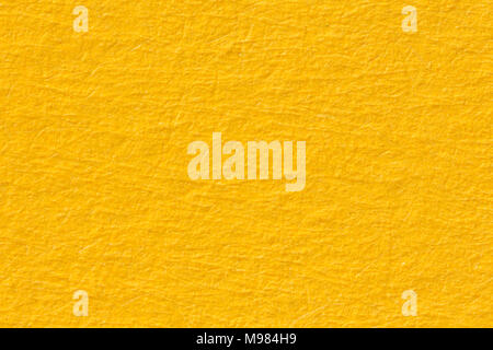 Yellow paper texture useful as a background. Stock Photo