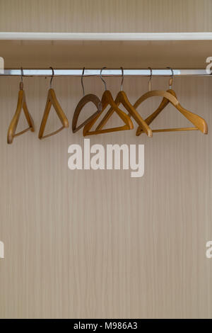 Empty coat hangers in a closet Stock Photo