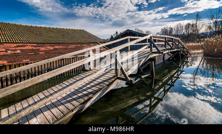 Germany, Bavaria, Seehausen am Staffelsee, boat houses and wooden bridge Stock Photo