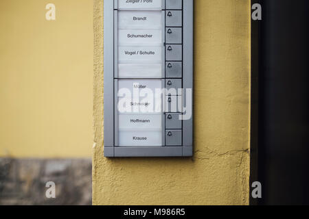 Germany, doorbell button panel with empty nameplate of deceased neighbour Stock Photo