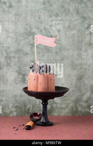 Chocolate icecream tartlet with blackberry and cacao nibs Stock Photo