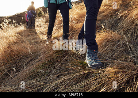 Close-up of people hiking in the mountains Stock Photo