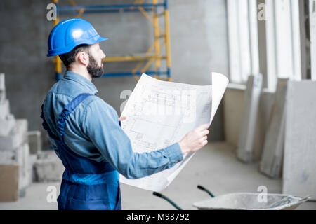 Builder at the construction site Stock Photo