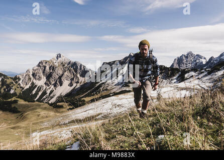Austria, Tyrol, young man hiking in the mountains Stock Photo
