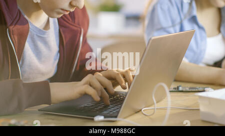 Smart Young Boy Works on a Laptop For His New Project in His Computer Science Class. Stock Photo