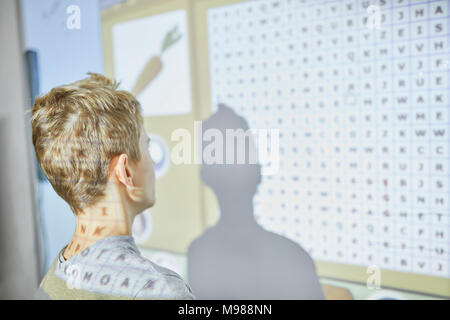 Student in class at interactive whiteboard Stock Photo